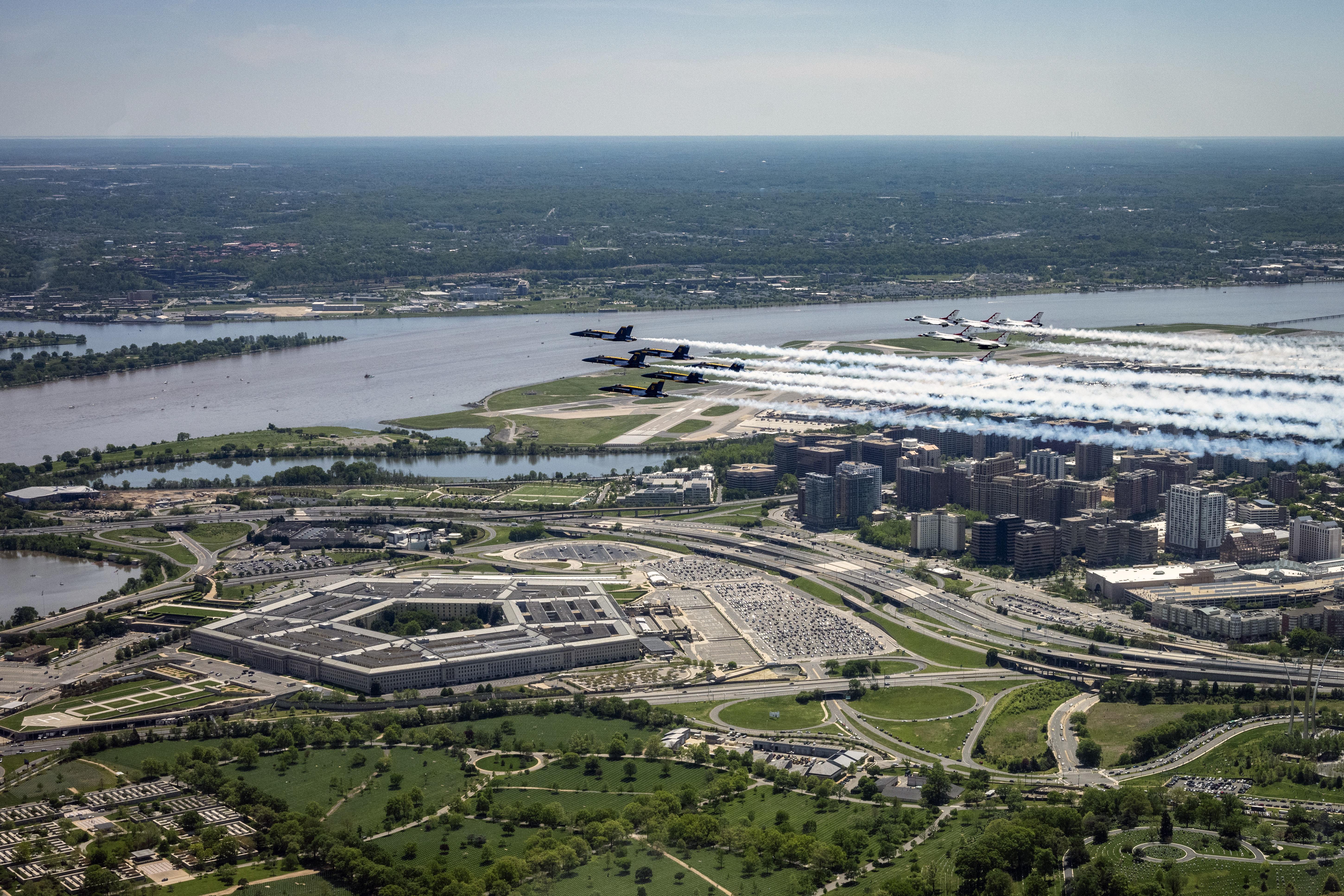 The Air Force and Navy flight demonstration squadrons, the Thunderbirds and the Blue Angels, fly over the Pentagon, May 2, 2020, as part of “America Strong,” a collaborative salute from the two services to honor health care workers, first responders, service members and other essential personnel during the COVID-19 pandemic.