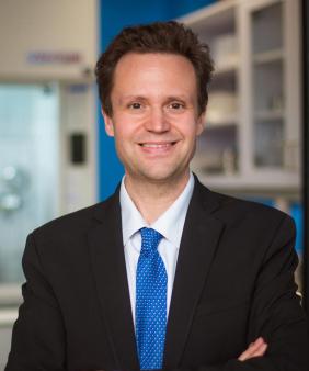 Prof. Markus Buehler stands in a laboratory